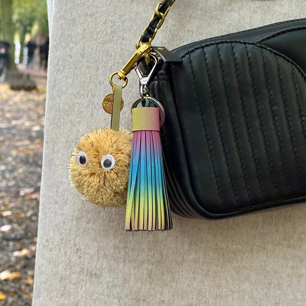 Pom-pom keychain with rainbow tassel bag charm from Firelfy Reflectrors.